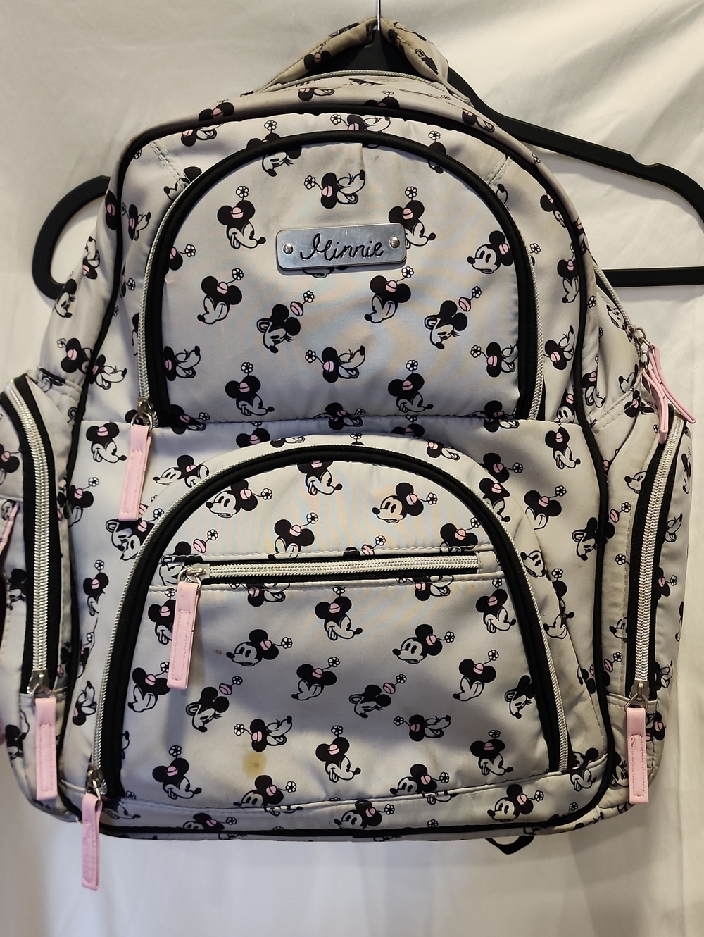 Disney Baby Minnie Mouse Diaper Bag Backpack featuring an all-over Minnie print